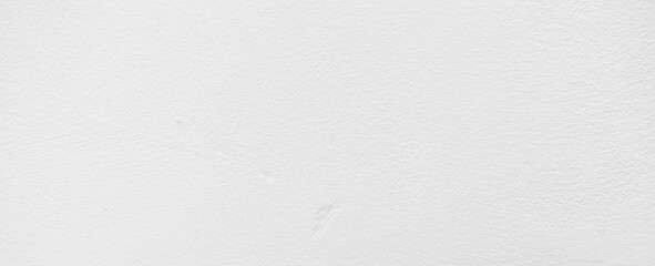 White concrete wall texture background. Uneven render stucco white painted concrete wall texture background. Rough and grunge wall.