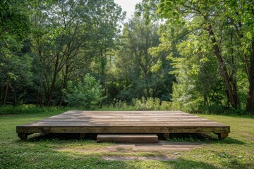 Fototapeta premium A rustic, empty outdoor stage surrounded by trees, with a wooden platform and a simple backdrop. 