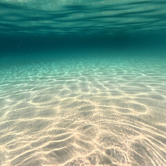 Underwater photo with deep blue sea and beautiful light rays with sandy floor - Italy, Apulia, Taranto