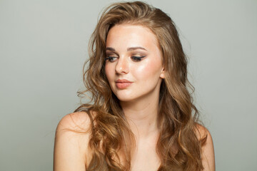 Naklejka premium Healthy smiling young adult woman studio photo