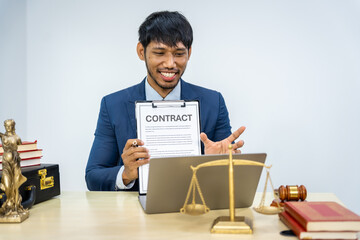 A male Asian lawyer in a formal suit handles contracts, agreements, legal obligations, and...