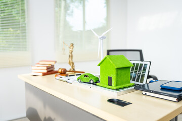 A lawyer's desk without people, focused on environmental law for 2050, contracts, and legal matters, with emphasis on sustainability and reducing environmental impact.