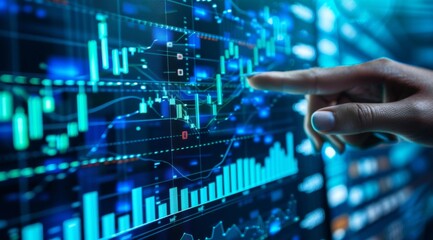 business person is pointing at stock market graphs on an interactive screen, with blue and green color tones used for financial data visualization
