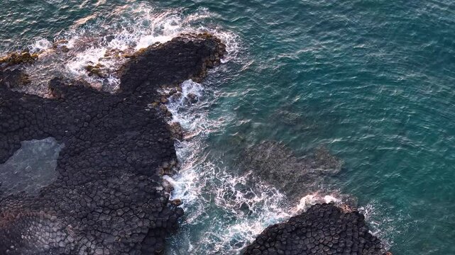 View of Ganh Da Dia or Da Dia Reef is a seashore area of uniformly interlocking basalt rock columns located along the coast in Tuy An town, Phu Yen Province, Vietnam. Travel and landscape concept