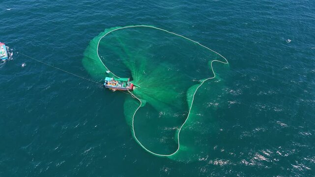 Aerial view of traditional wooden boat and fishermen are fishing anchovies in Yen Island, Phu Yen province, Vietnam. Travel and landscape concept