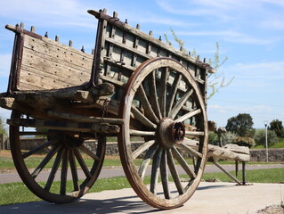 Obraz premium antique cart pulled by animals battered eroded wood