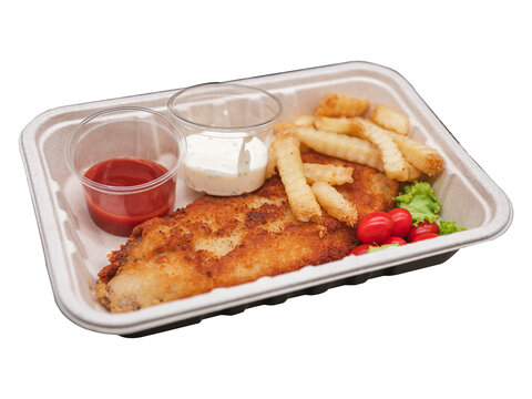 Deep fried cripy fish serves with fries and white sauce on