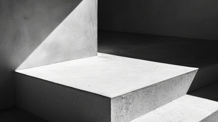 A concrete platform bathed in sunlight, casting shadows on the surrounding walls
