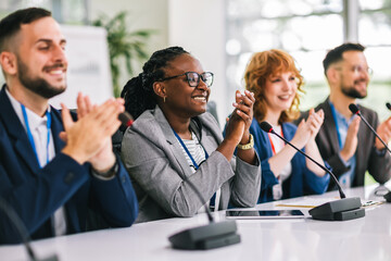 Group of multiracial business people applauding on a business meeting.