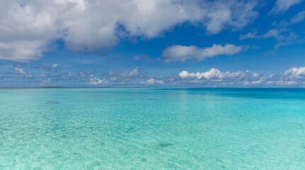 Beautiful summer sea. Sunny exotic tropical beach. Nature horizon sea and bright blue sky with clouds with sunlight. Summertime seascape, turquoise ocean water, idyll island meditation, inspire 