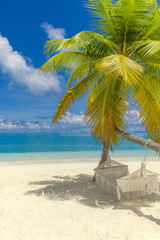 Obraz premium Tropical beach panorama. Summer relax nature landscape. Luxury travel beachfront swing hammock on beautiful palm tree, white sand calm sea sky exotic tourism. Amazing vacation tranquil paradise scene