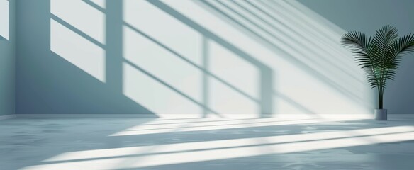 Empty room with sunlight casting geometric shadows on the walls and floor