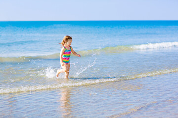 Kids playing on beach. Children play at sea.