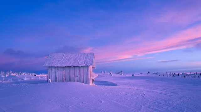 Cabin in mist in snowy view , in norway