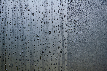 Clear water droplets on dark cover background. Suitable for design and wallpaper