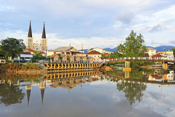 Fototapeta premium Stunning View of Cathedral of the Immaculate Conception as Seen from the Chantaboon Waterfront Community, Chanthaburi, Thailand