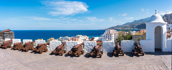 Row of medieval city defense cannons in Santa Cruz de la Palma, Canary Islands.