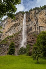 Scenic view of a waterfall cascading down a cliff. Lauterbrunnen Switzerland