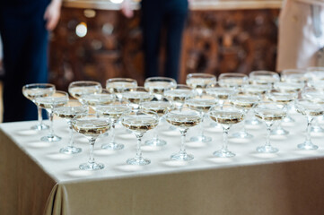 Glasses of champagne at the Banquet, white sparkling wine in wine glasses, festive mood