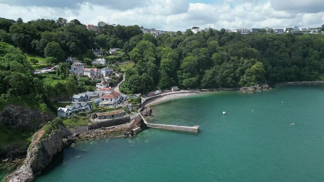 Babbacombe, South Devon, England: DRONE VIEWS: The drone circles Babbacombe beach and harbour wall revealing Oddicombe beach (far right). Babbacombe is a popular UK holiday destination (Clip 12).