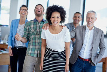 Celebration, teamwork and businesswoman with colleagues in office for success, achievement or...