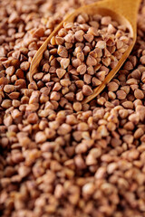 Wooden Scoop with Raw Buckwheat, Close-Up