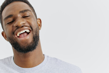 Obraz premium Excited man with wide open mouth and beaming smile expressing joy and enthusiasm in closeup portrait