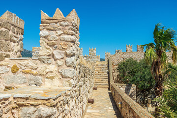 Raised protected walkway also crenelated parapet in historic Marmaris Castle in Turkey.