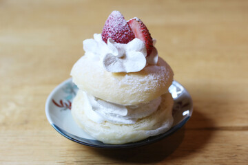 plate of donut cream with strawberries