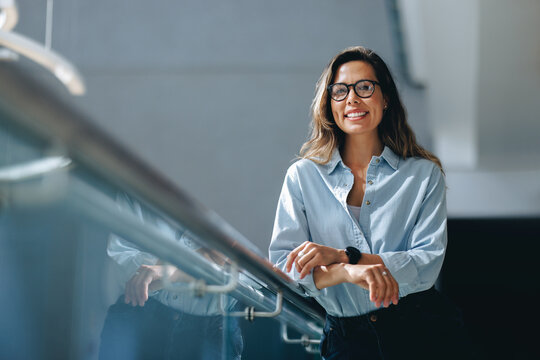 Portrait of a business woman smiling at the camera, confident in herself as an entrepreneur