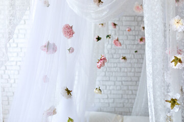 Summer pink flowers levitating, hanging flowers on a white background, copy space. Template, mockup. White elegance lace texture curtains with floral abstract pattern with spring flowers levitate   © stock_studio