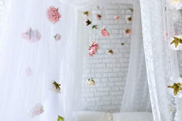 Summer pink flowers levitating, hanging flowers on a white background, copy space. Template, mockup. White elegance lace texture curtains with floral abstract pattern with spring flowers levitate   © stock_studio