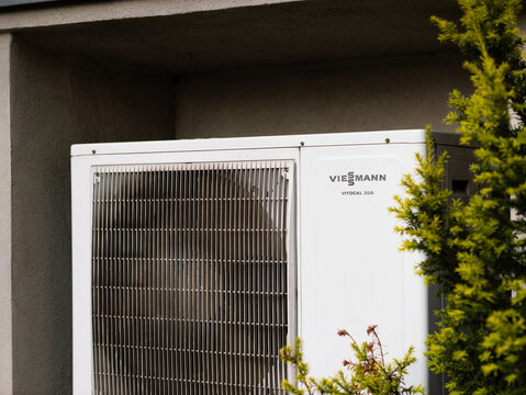 DRESDEN, GERMANY - 8. July 2024: Viessmann Vitocal 200 heat pump close up. Technical product as part of the heating system. Modern technology used for temperature conditioning in a domestic home.