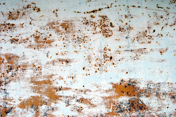 Orange and write paint background with rusty scratches. White brushes on an orange rusty background. Aged texture in orange and white. Grunge texture.