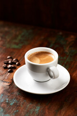 Cup of coffee on wooden background. Close up.	