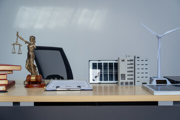 Empty lawyer desk with golden scales, a law book, leather bags, and a Lady Justice statue legal principles and personal freedom, surrounded by sustainability, renewable energy
