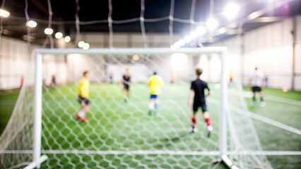Soccer Field Blur - A soccer field with players and goalposts, out of focus.
