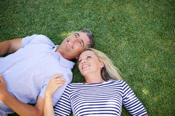 Relax, grass and mature couple in nature for romantic outdoor date with bonding and connection....