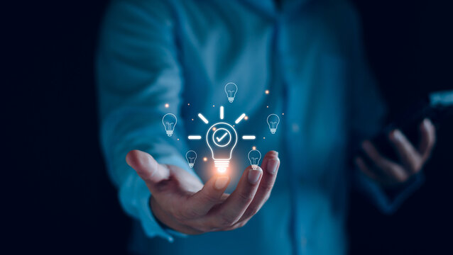 Business solution idea concept. Businessman  creative light bulbs with marketing network, planning strategy, analysis solution and development, modern business technology, Innovative of new idea.