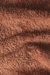 Texture of a brown faux fur as a background.