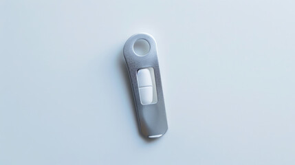 A single pill cutter on a white background, symbolizing medication management