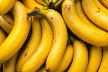 Close-up of a bunch of fresh, ripe yellow bananas with a natural background, perfect for a healthy, organic, and nutritious diet, great for vegetarian or vegan snacks, rich in potassium and vitamins