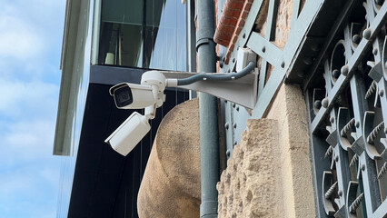 CCTV surveillance security camera video equipment in tower home and house building on wall for safety system area control outdoor with copy space