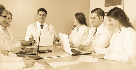 Doctors in negotiations in conference room