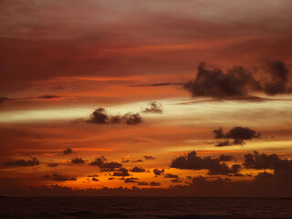Beautiful sunset on the ocean shore with a view of the islands