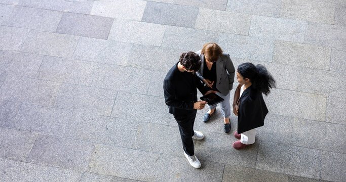 Team of diversity business people are discussing over the new strategic strategy project on investment real estate while walking around the office building for new project and planning