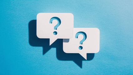 Double Question Mark Speech Bubbles on Blue Background Highlighting Business Inquiry and Support Concept