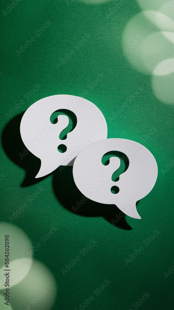 Poster question mark speech bubbles on vibrant green background with soft light bokeh - symbolizing busines