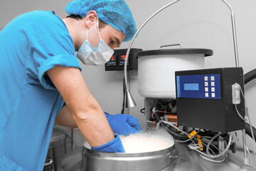 Embryologists a Liquid Nitrogen Bank Containing Sperm and Eggs Samples. ivf in vitro fertilization, egg freezing. Sperm cryopreservation. Sperm freezing.