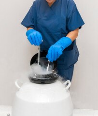 Embryologists a Liquid Nitrogen Bank Containing Sperm and Eggs Samples. ivf in vitro fertilization,...